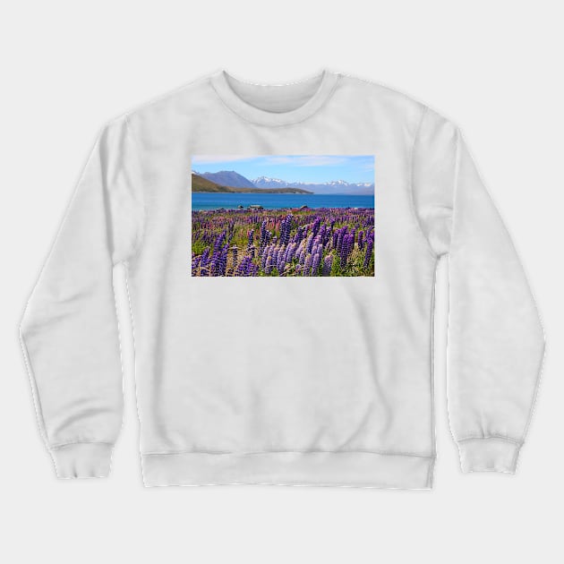 Lake Tekapo and wild flowering lupins Crewneck Sweatshirt by JohnDalkin